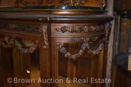 Unique Victorian curved glass lighted china cabinet, lots of applied garlands of roses motif