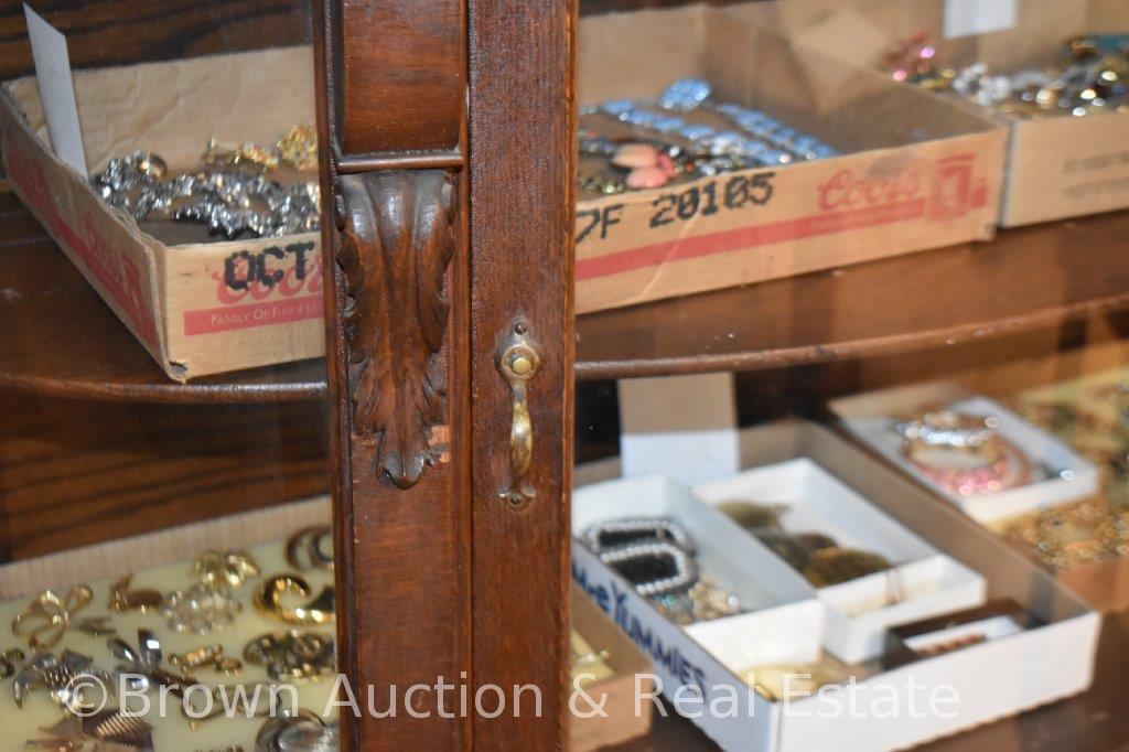 Curved glass china cabinet with paw feet