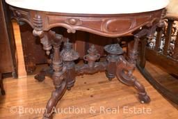 Marble top parlor table, very ornate base and legs