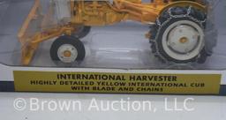 International Harvester Cub tractor with blade and chains, 1:16 scale die-cast