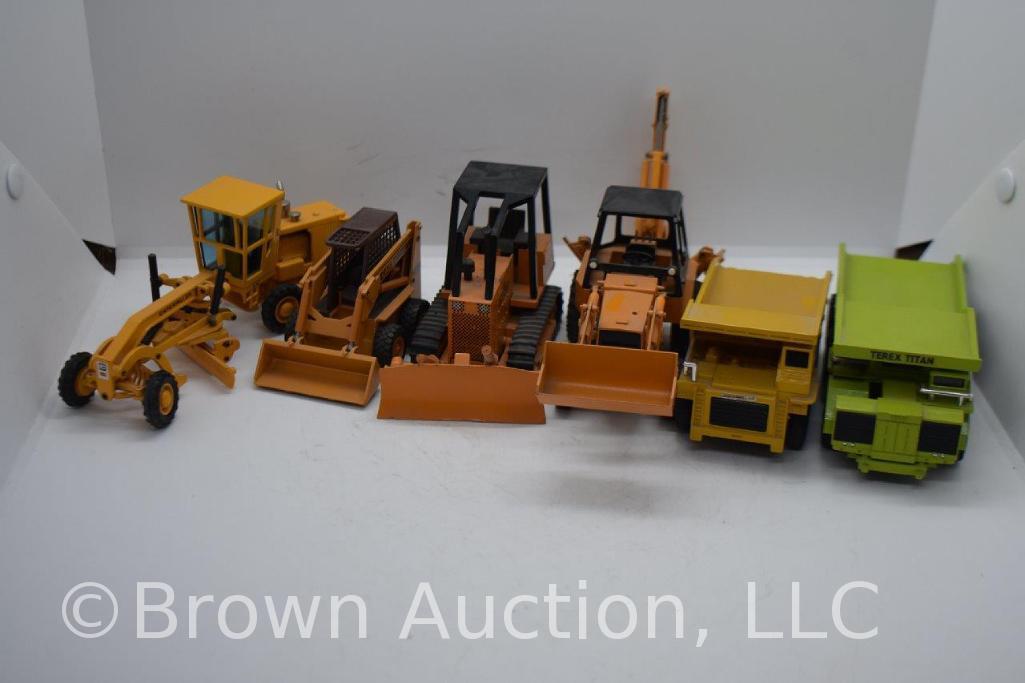 assortment of die-cast construction tools