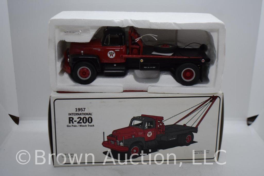 (2) 1957 International R-200 Gin Pole/Winch Trucks, die cast, 1:34 scale