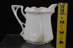 R.S. Prussia Stippled Floral Mold 3.5" creamer, Man in the Mountain