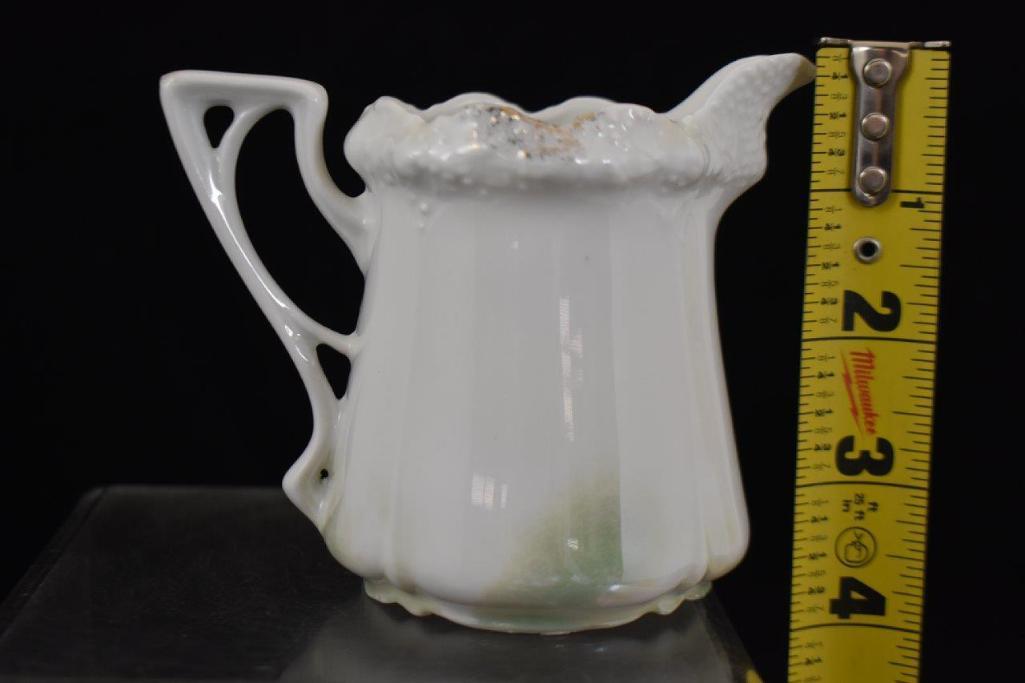 R.S. Prussia Stippled Floral Mold 3.5" creamer, Man in the Mountain