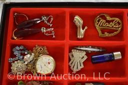 Assortment of jewelry: necklaces, earrings, brooches, belt buckle