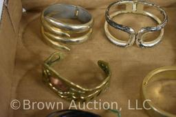 Assortment of gold and silver bracelets, several Art Deco style
