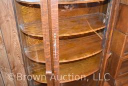 Antique curved glass china cabinet, mirror-backed top shelf