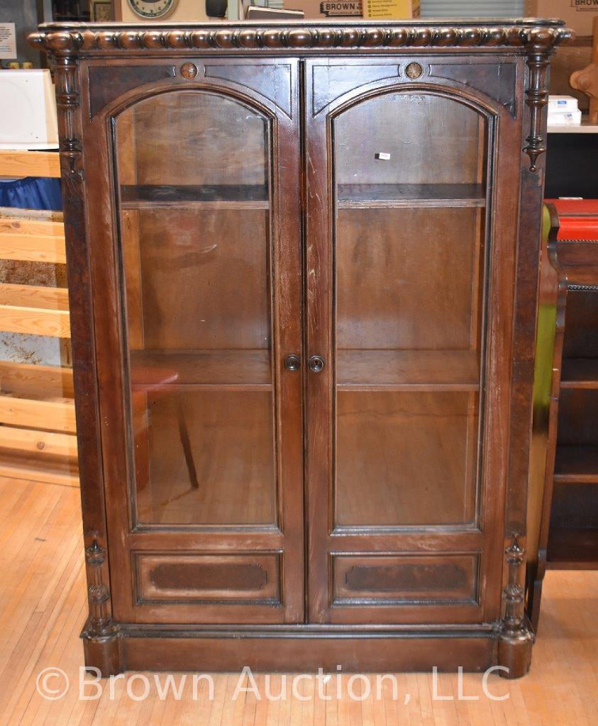 Antique china cabinet with decorative top, dbl. glass doors front