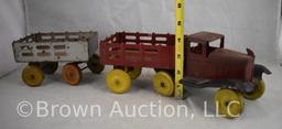 Girard pressed steel stake truck pulling extra wagon