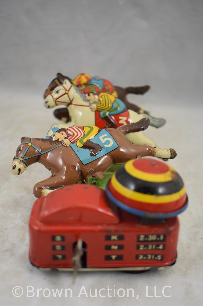 Assorted toys incl. friction Continental Trailways bus, wind-up race car driver, wind-up Derby horse