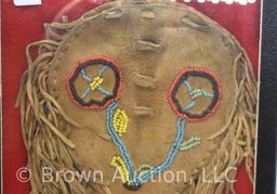 Native American Plains Indian leather (fringed and beaded) pipe bag and pipe