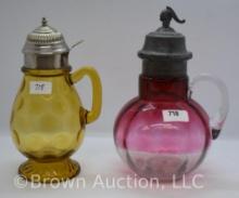 (2) Art Glass syrup pitchers: amber Inverted Thumbprint; Rubina