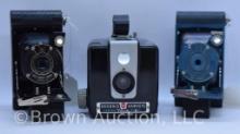 (3) Vintage Kodak cameras: (2) Vest Pockets - Rainbow Hawk-eye and Model B; (1) Brownie Hawkeye