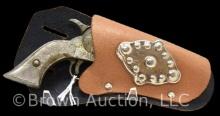 Hubley PAL mini die cast iron cap gun, 1950s, includes black and tan holster with decorative metal