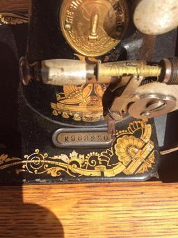 1900s Vintage Singer No 27-4 treadle sewing machine with manuals & attachments