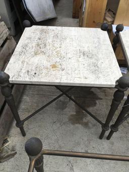 Steel patio tables. Two have travertine tops one is only the shell