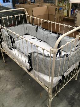 Vintage baby crib with bedding