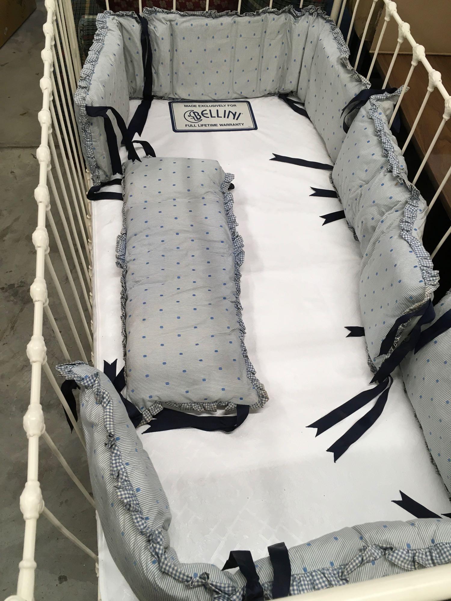 Vintage baby crib with bedding