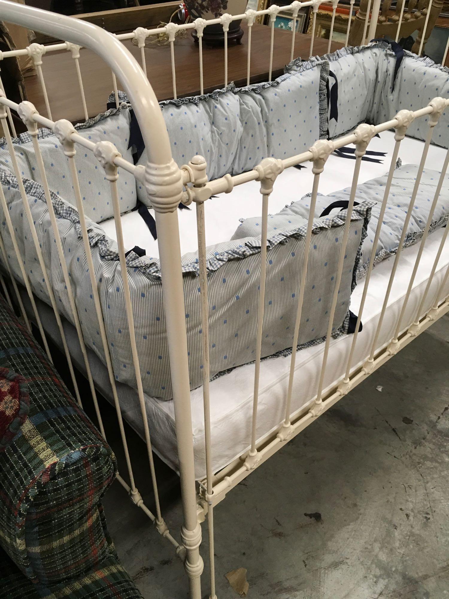 Vintage baby crib with bedding