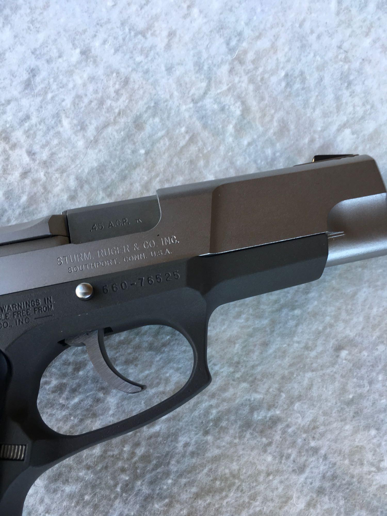 Firearms: Ruger P90 pistol. .45 ACP caliber. Serial # 660-76525. 2 clips ( NOT FOR SALE IN CALIF. )