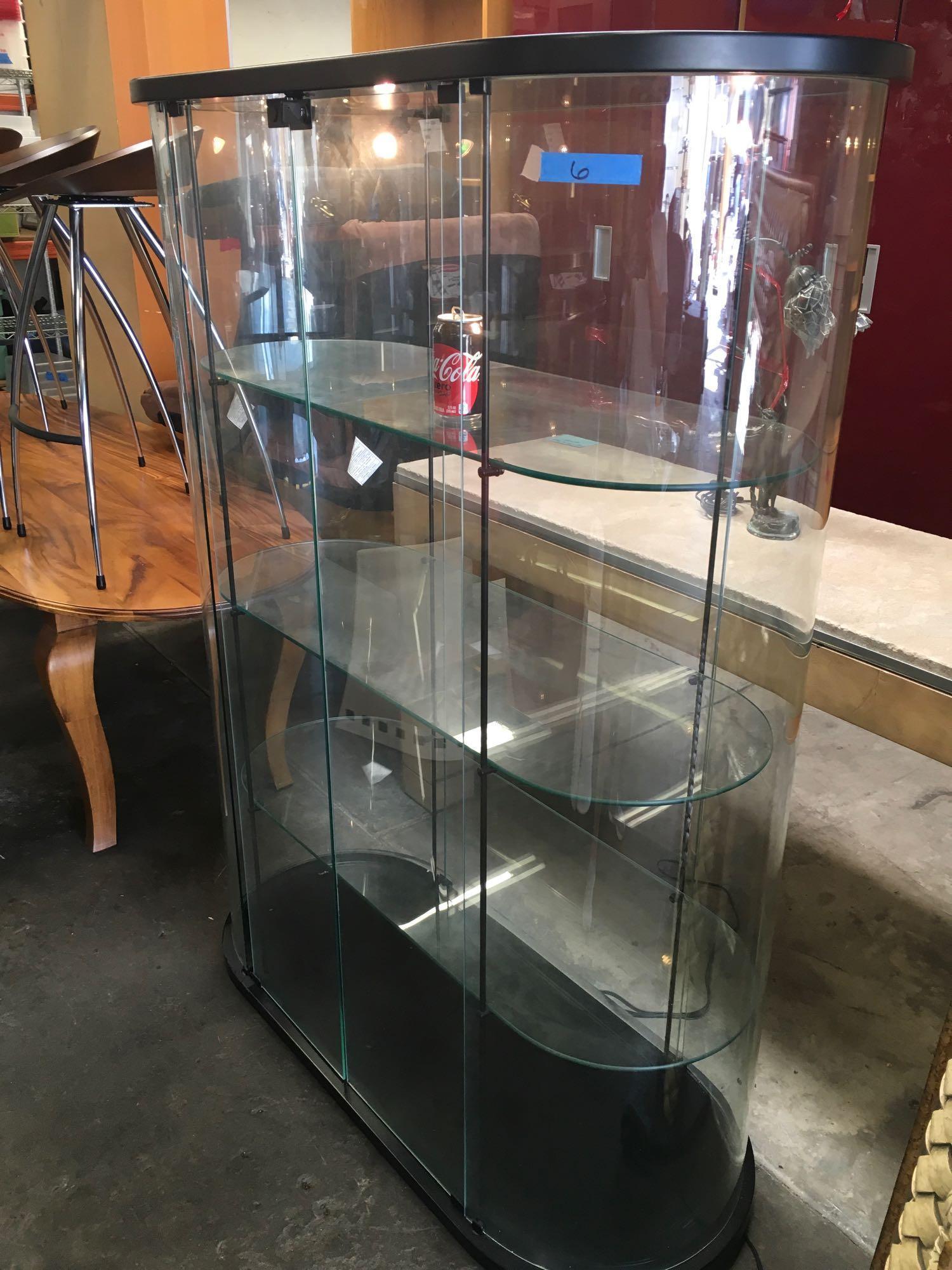 63" x 48" x 21", 3 tier, glass, locking cabinet. Lights up see pics