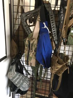 Rolling Grid display rack with assorted tactical gear ( vests, helmets, belts, etc)