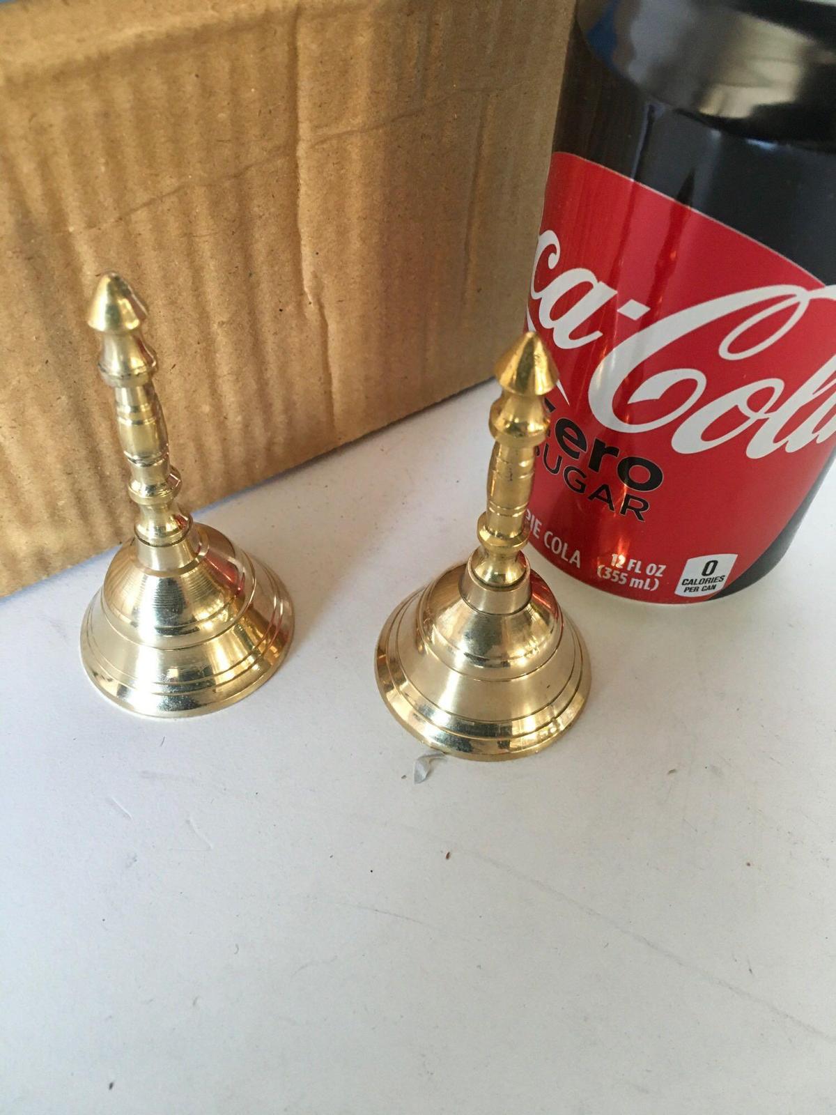 New, brass finish 3 12/" bell. 100 pieces