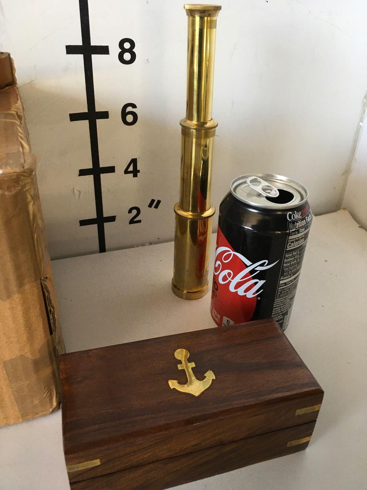 New nautical. 9" brass finish, telescope with wooden box. ( office use room G)