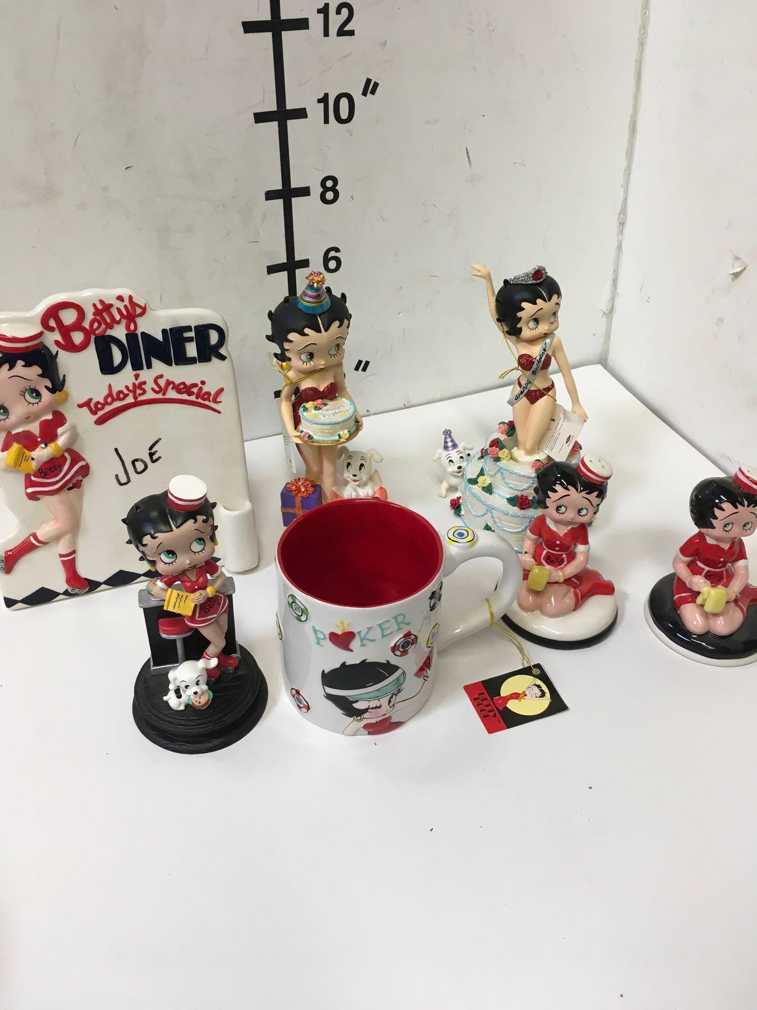 Collectible Betty Boop figurines, salt and pepper shakers, coffee cup, etc