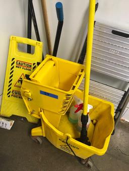 Assorted cleaning supplies, mop bucket, mop, step stool, caution sign, dust pan, broom, etc.