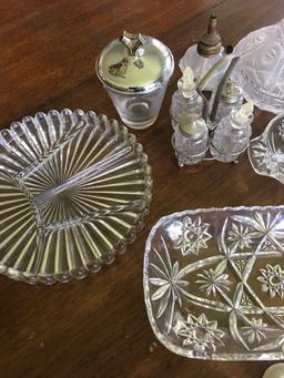 12 pieces. Crystal, glass, plastic pieces. Serving dishes, carafe, condiment caddy, etc