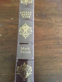 Vintage, new sealed Adventure of Huckleberry Fin book. Couple of holes in the seal