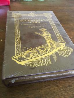Vintage, new sealed Adventure of Huckleberry Fin book. Couple of holes in the seal