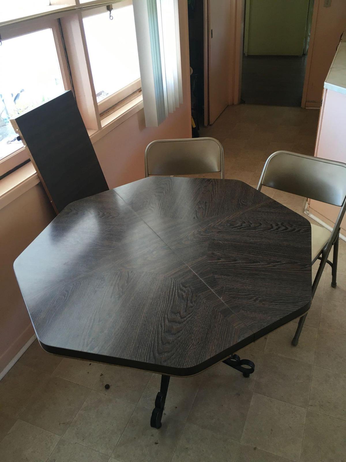 Octagon table 28" x 41" with leaf , (2) Samsonite foldable chairs,