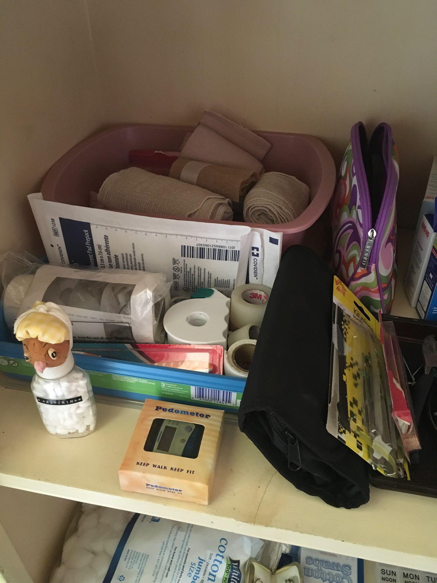 Lot of assorted bandages, gauze, heating pads, cotton balls, perfumes deodorant blocks, razors, etc