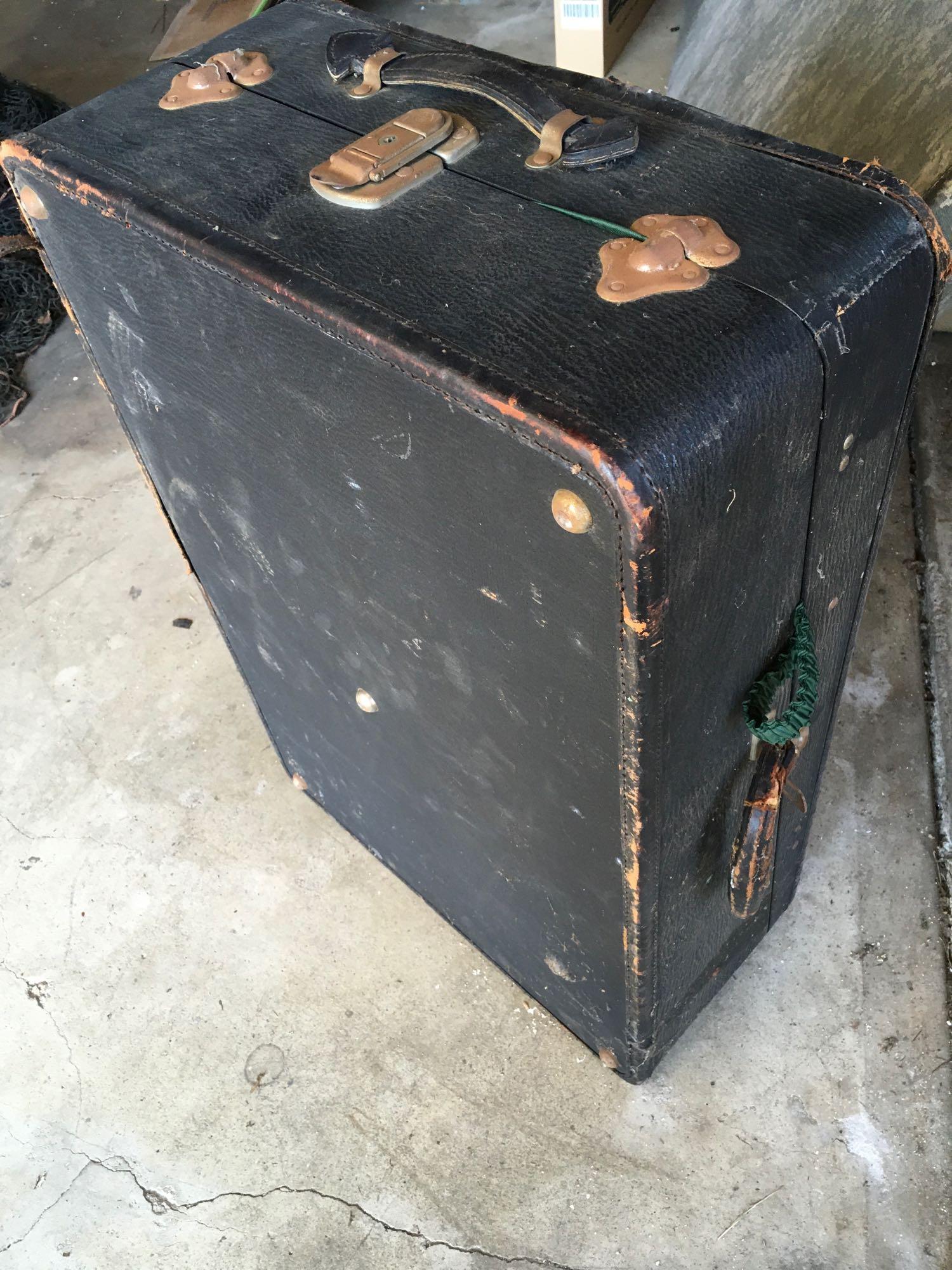 Vintage luggage. One has tag Multnoman Hollywood Luggage