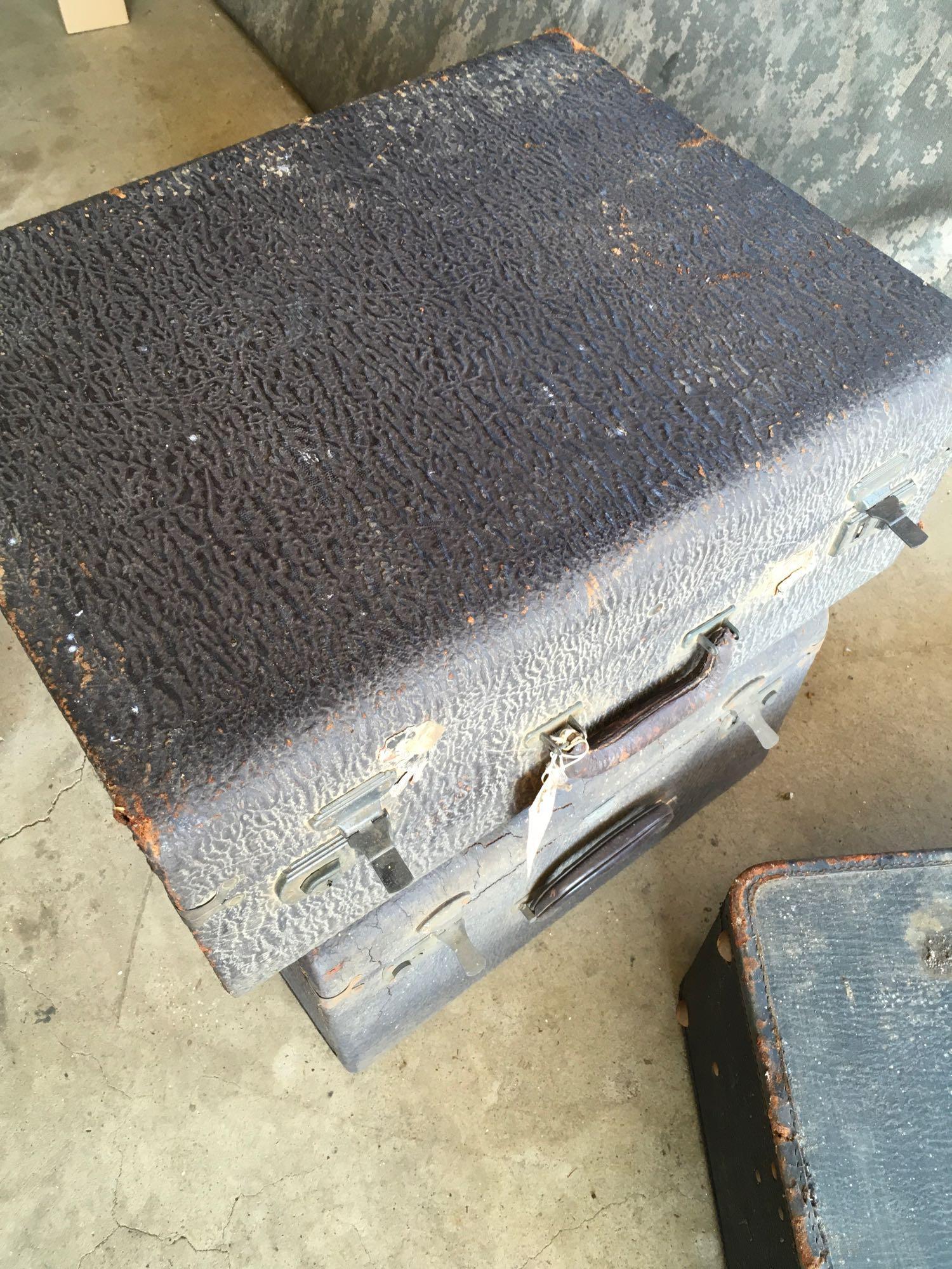 Vintage luggage. One has tag Multnoman Hollywood Luggage