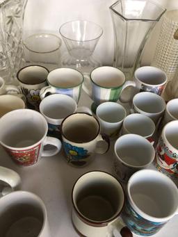 Lot. Assorted coffee mugs, glass pitcher, vases, etc