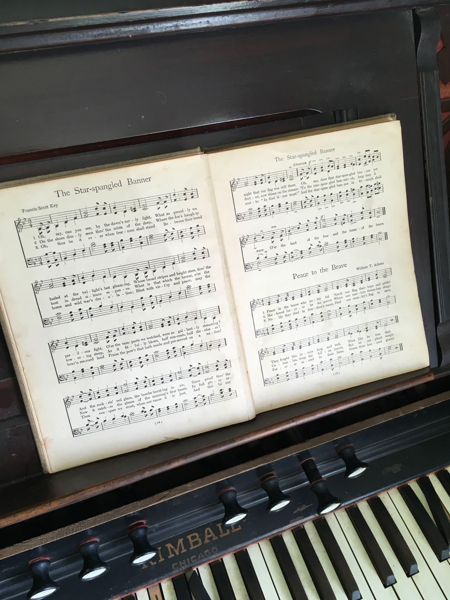 Victorian Kimball Chicago pump organ, stamped 189749 & "Songs Every One Should Know" book