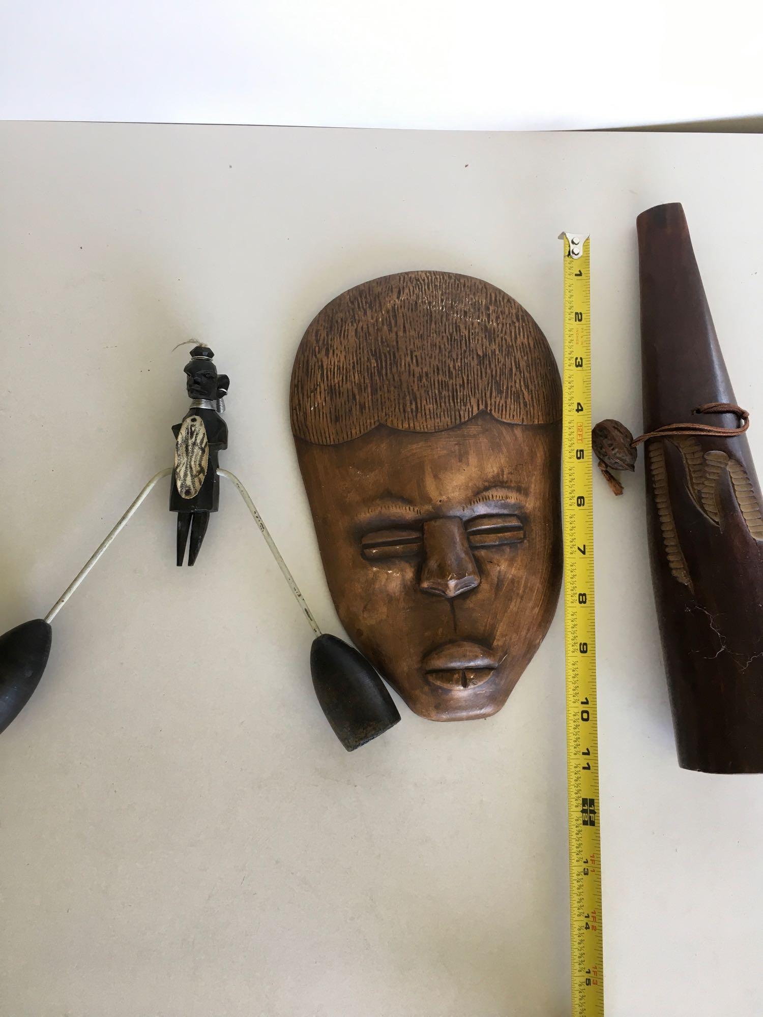 Assorted decorative items. Mask made in Mexico wood with metal figurine, wood hand carved bottle