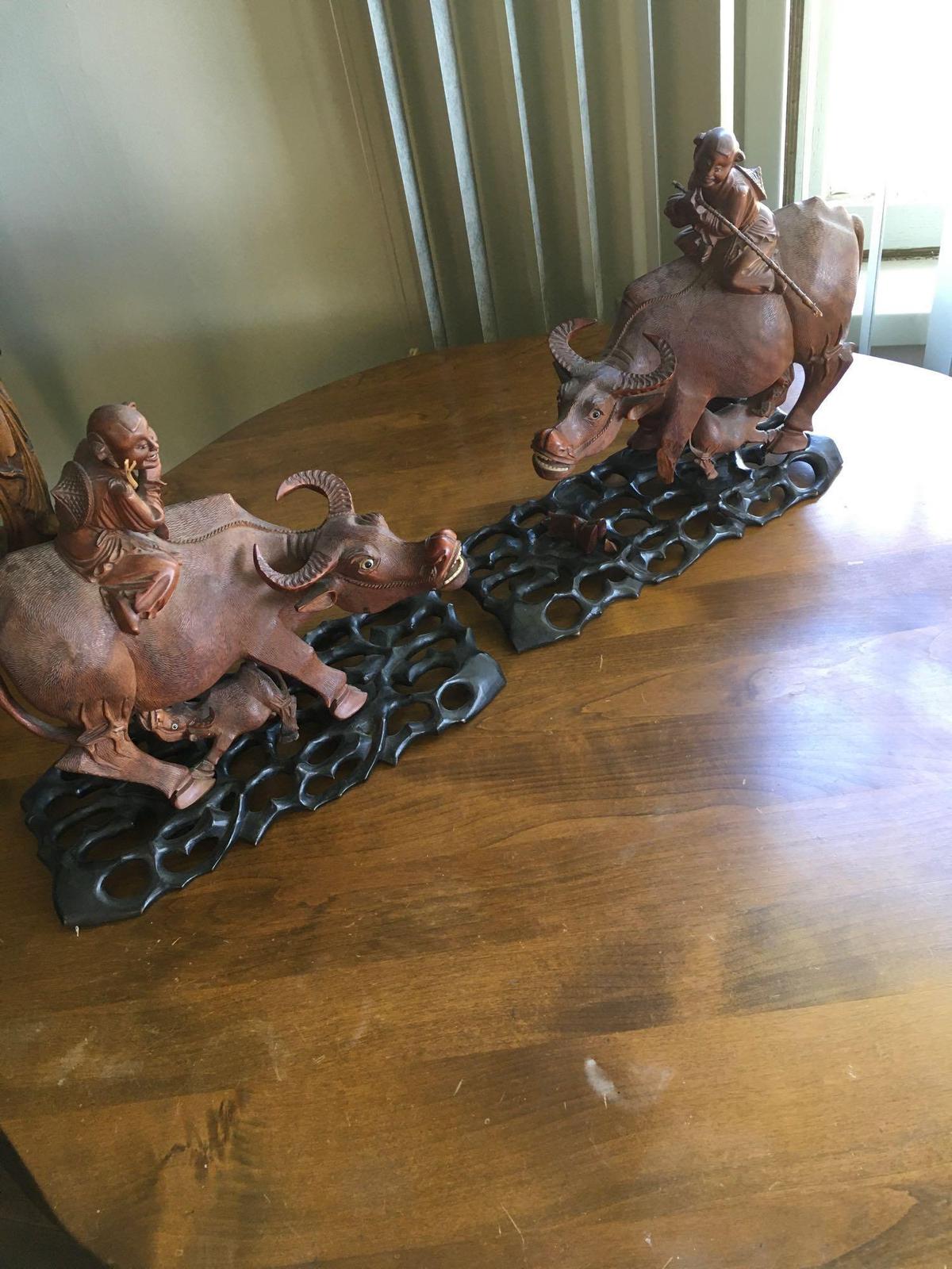 Vintage. Hand carved Wood. Oriental Man ridding Buffalo with baby figurines with stands.