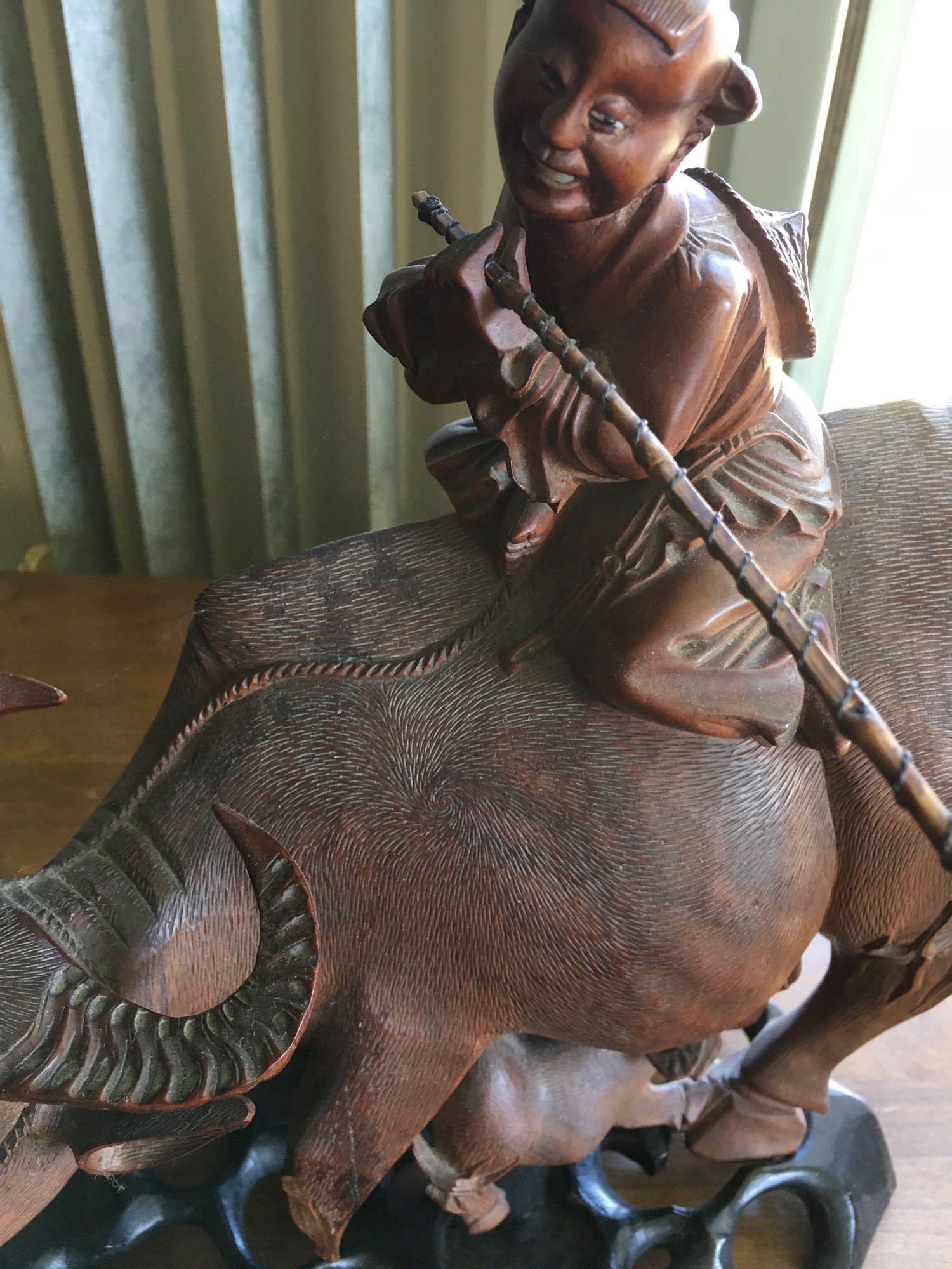 Vintage. Hand carved Wood. Oriental Man ridding Buffalo with baby figurines with stands.