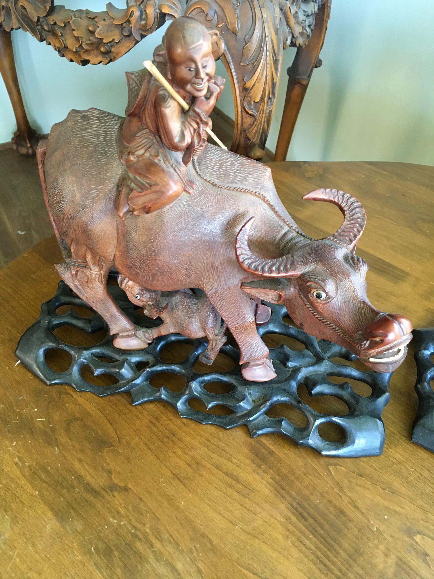 Vintage. Hand carved Wood. Oriental Man ridding Buffalo with baby figurines with stands.