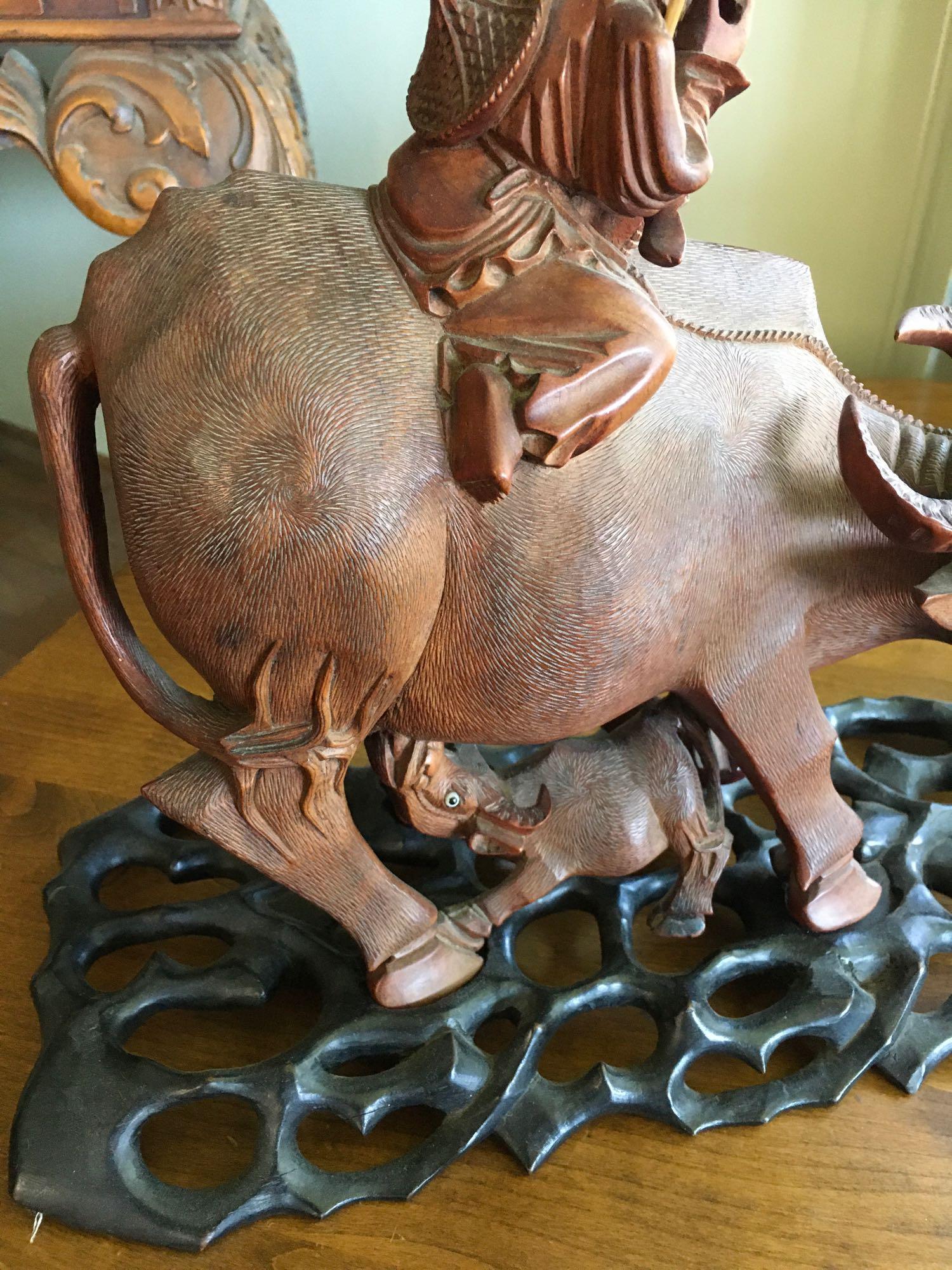 Vintage. Hand carved Wood. Oriental Man ridding Buffalo with baby figurines with stands.