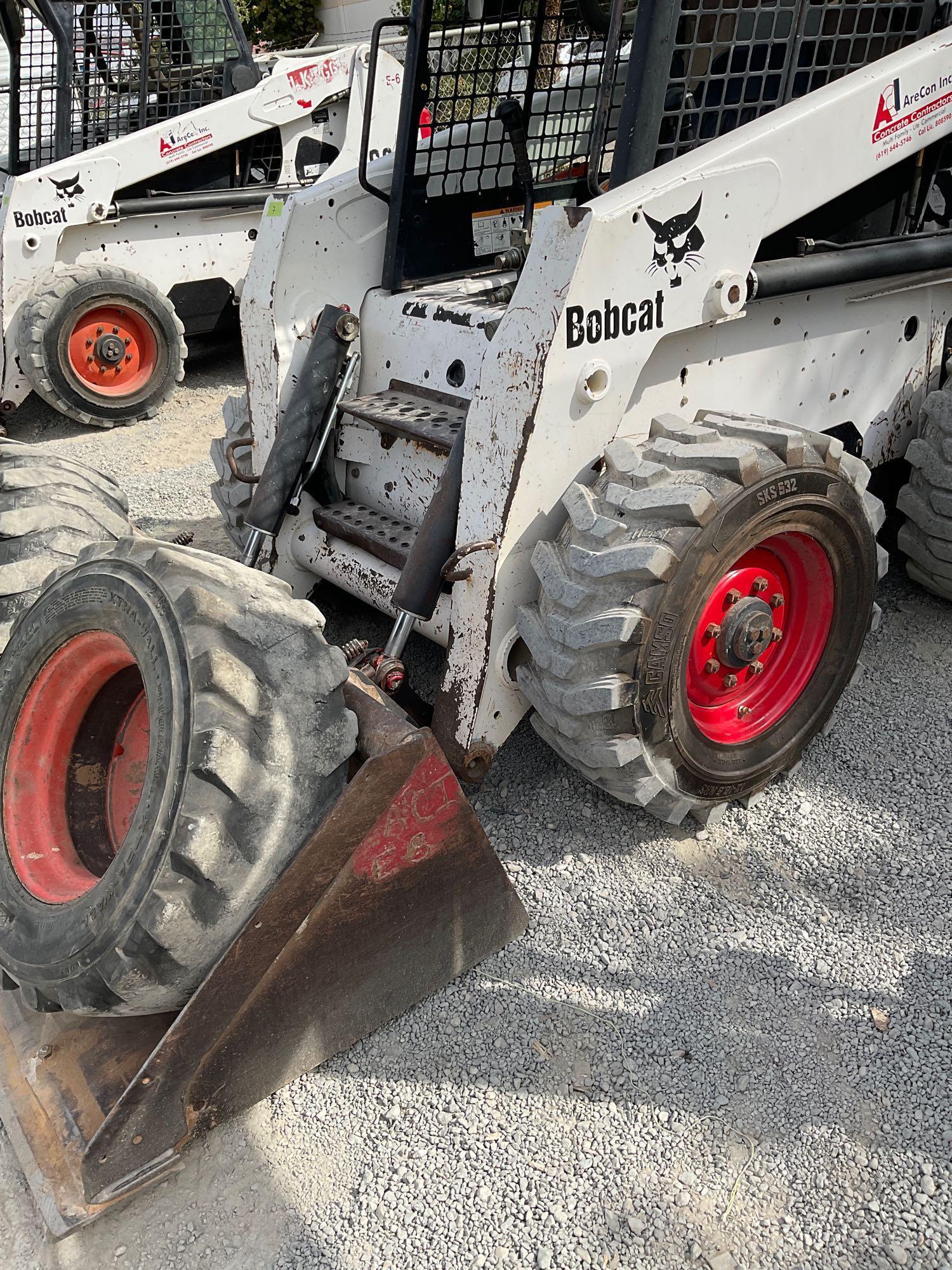 Bobcat S220 Skid Steer, diesel power with set of directional tires, 5587 hours with manual