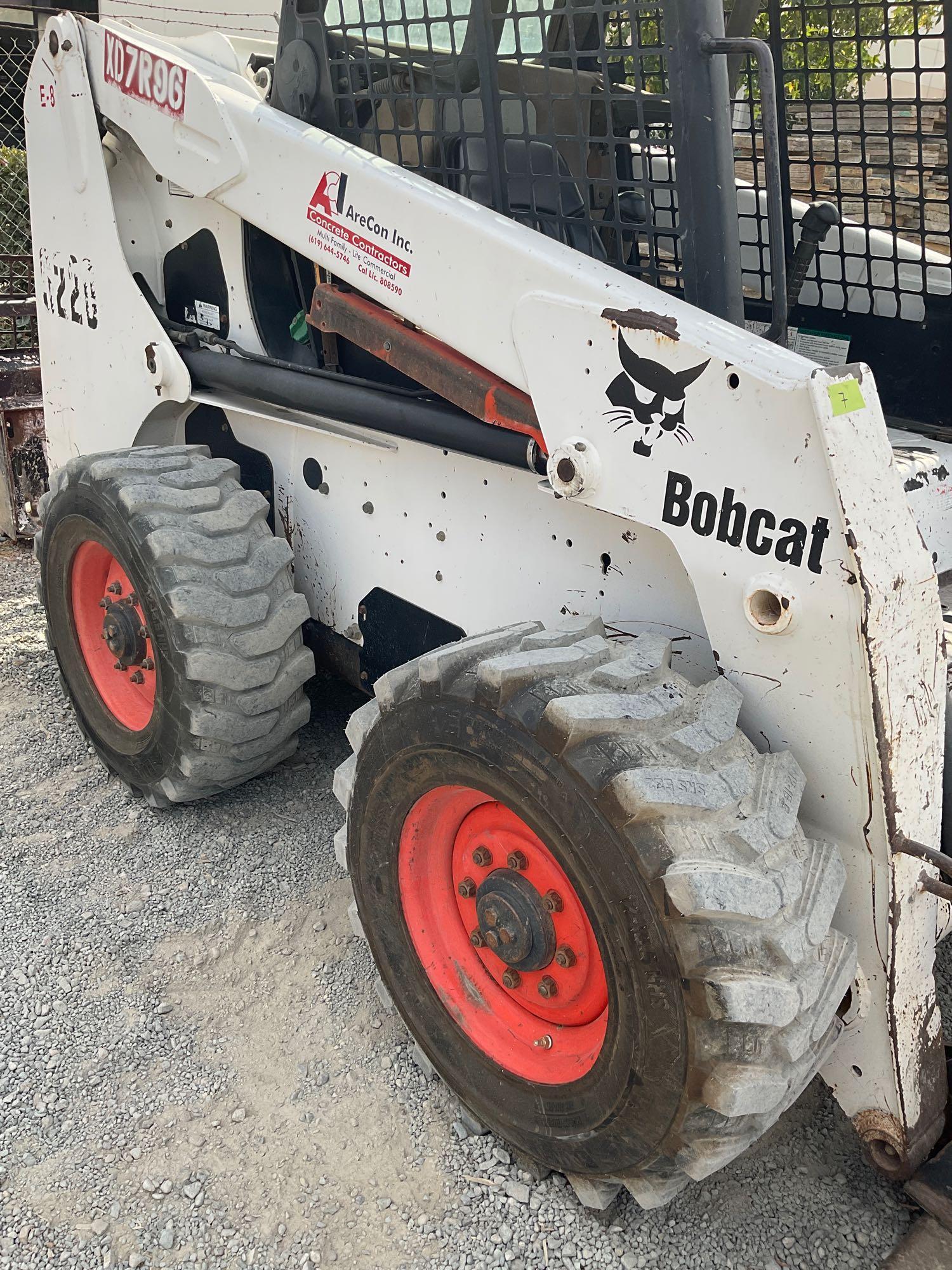 Bobcat S220 Skid Steer, diesel power with set of directional tires, 5587 hours with manual