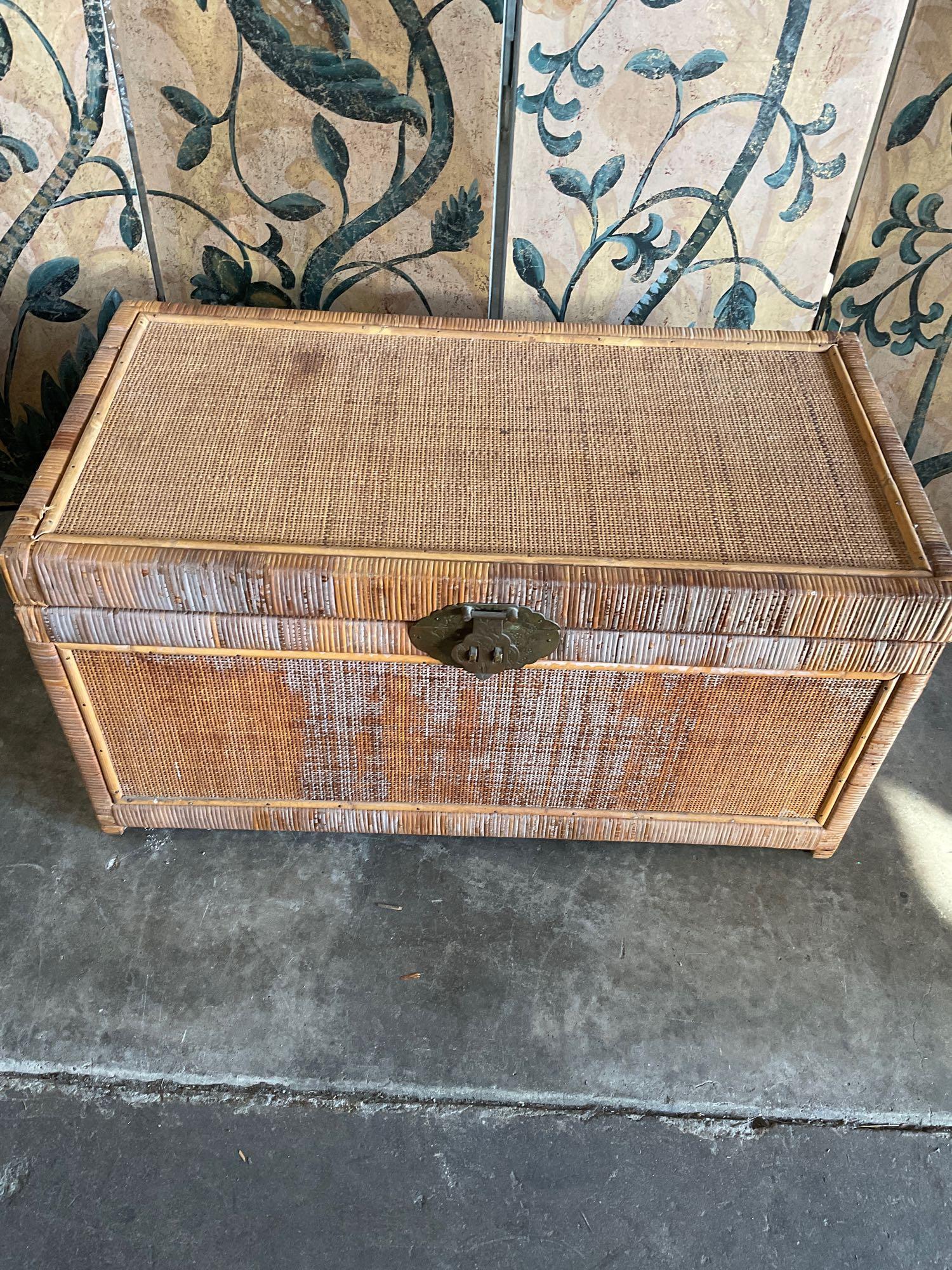 Vintage wicker trunk with metal accents. 16" T. 31" W x 16"D