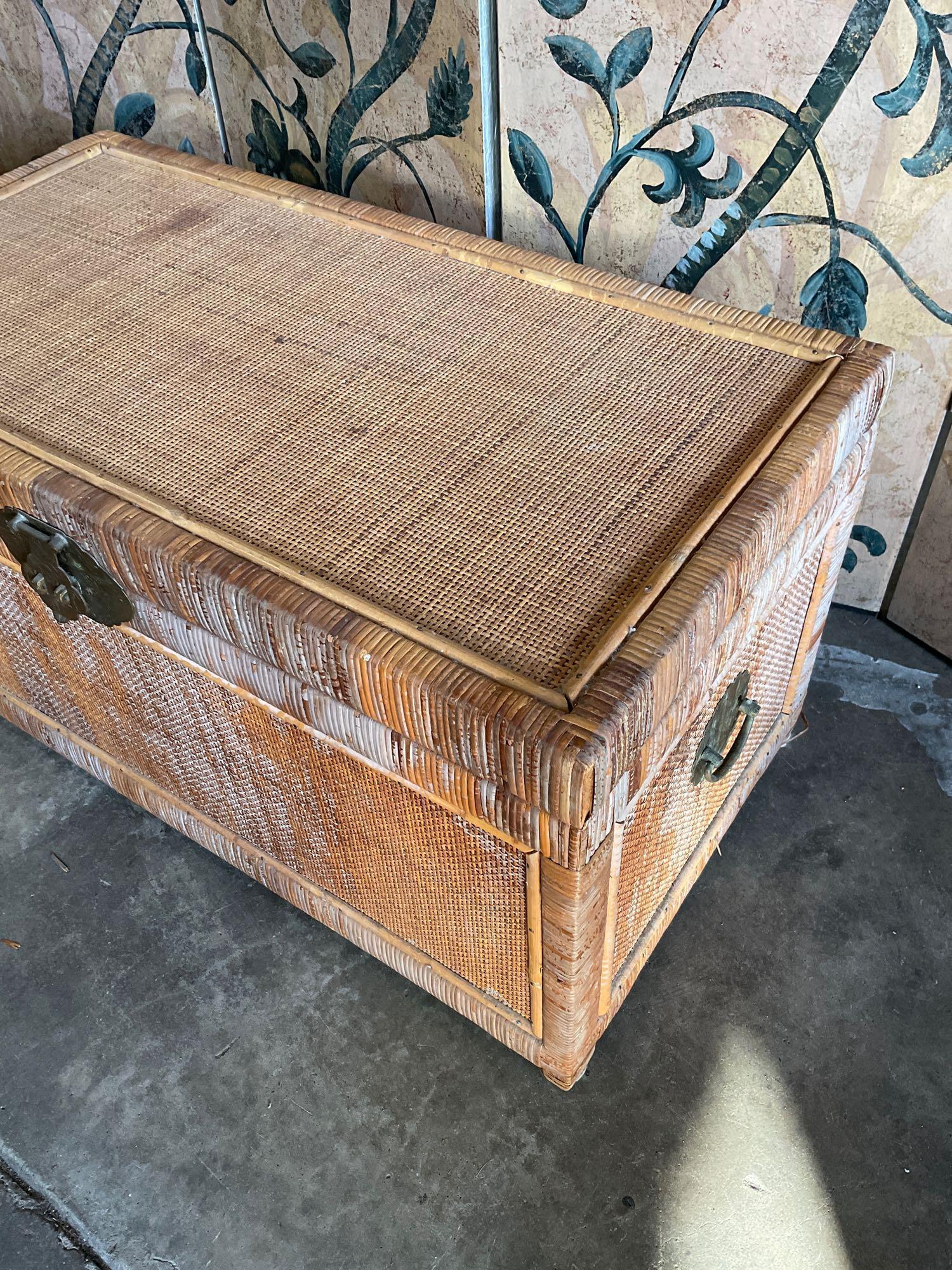 Vintage wicker trunk with metal accents. 16" T. 31" W x 16"D
