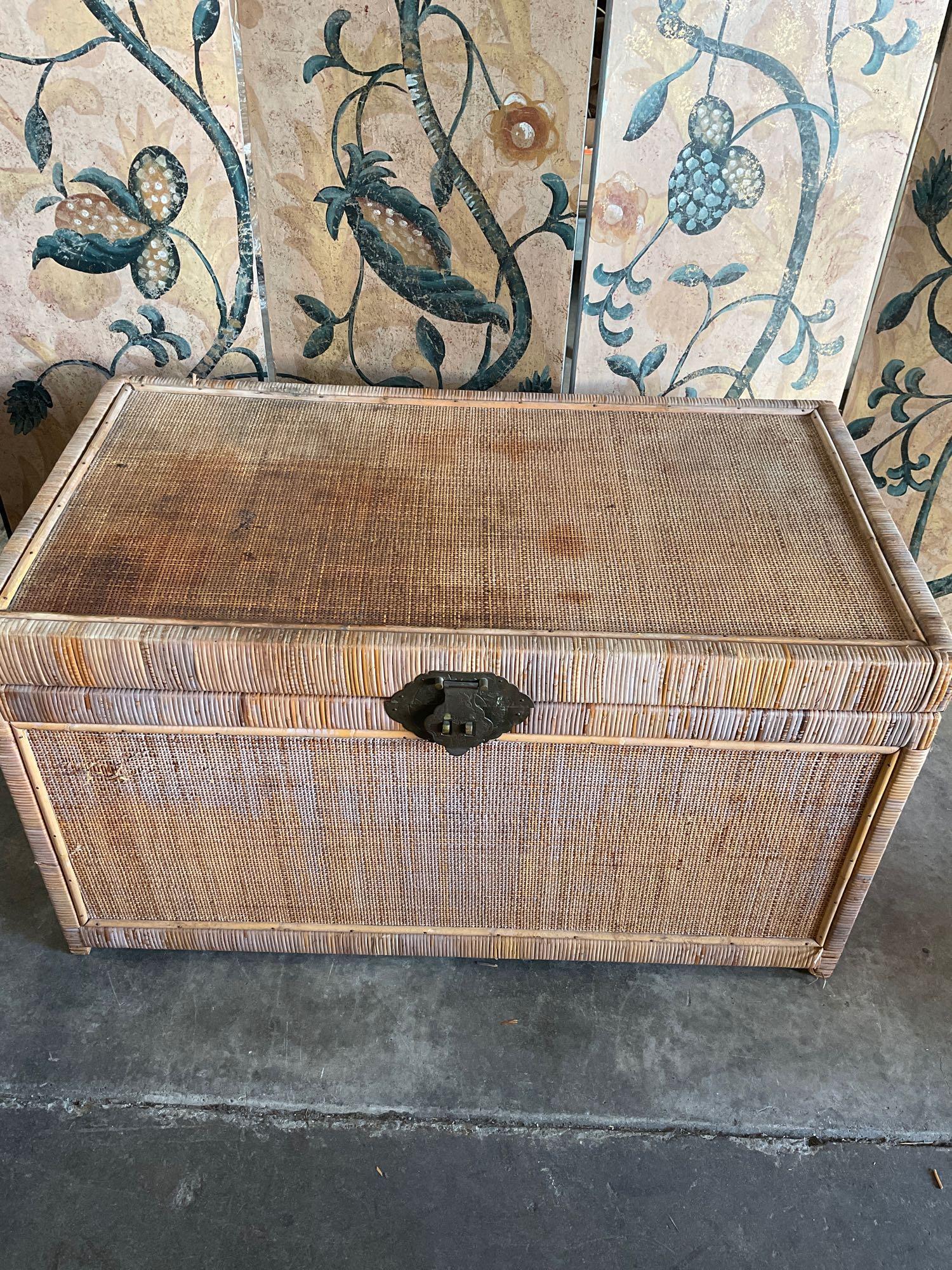 Vintage wicker trunk with metal accents. 20" T. 36" W x 20" D