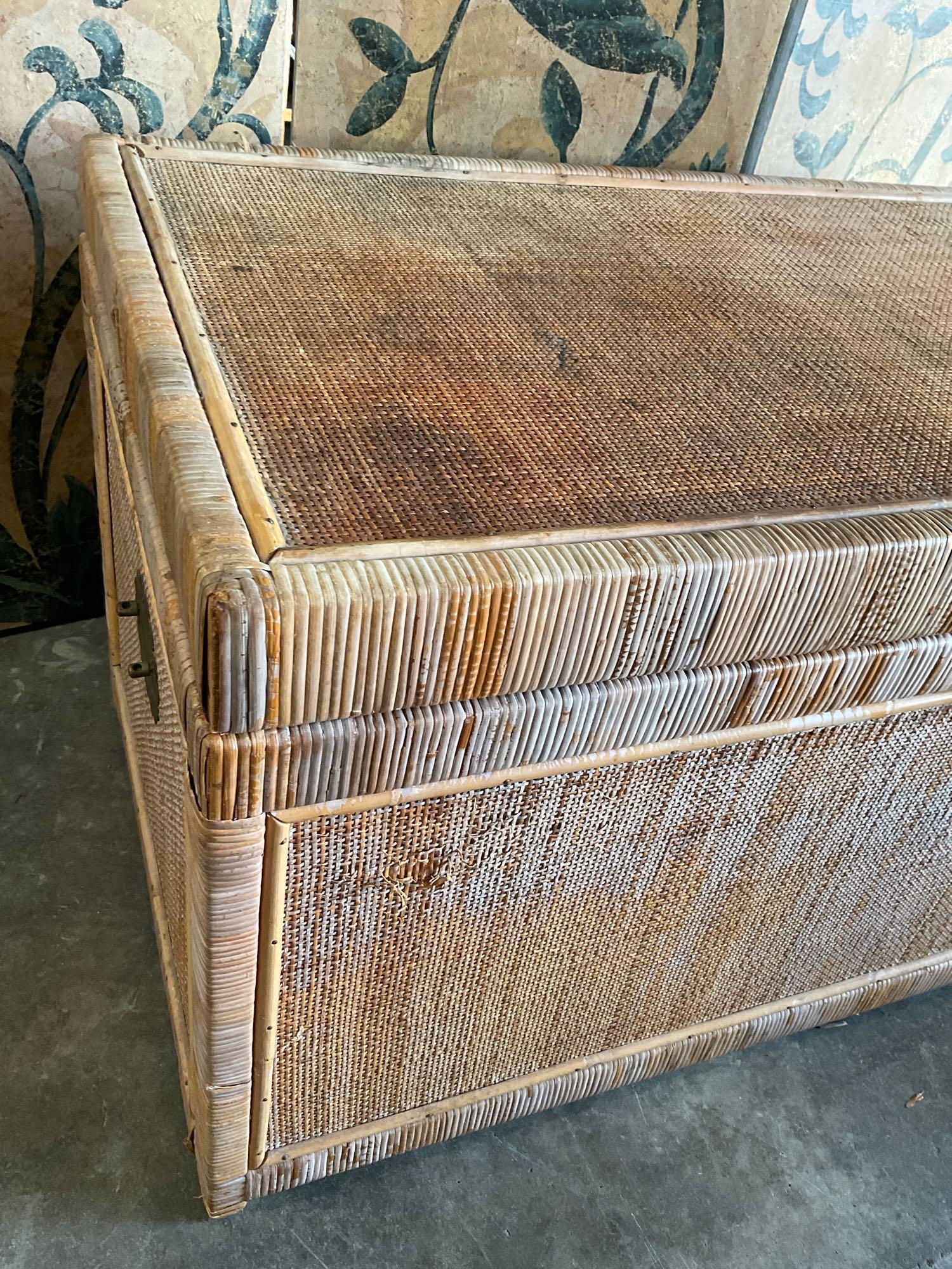 Vintage wicker trunk with metal accents. 20" T. 36" W x 20" D